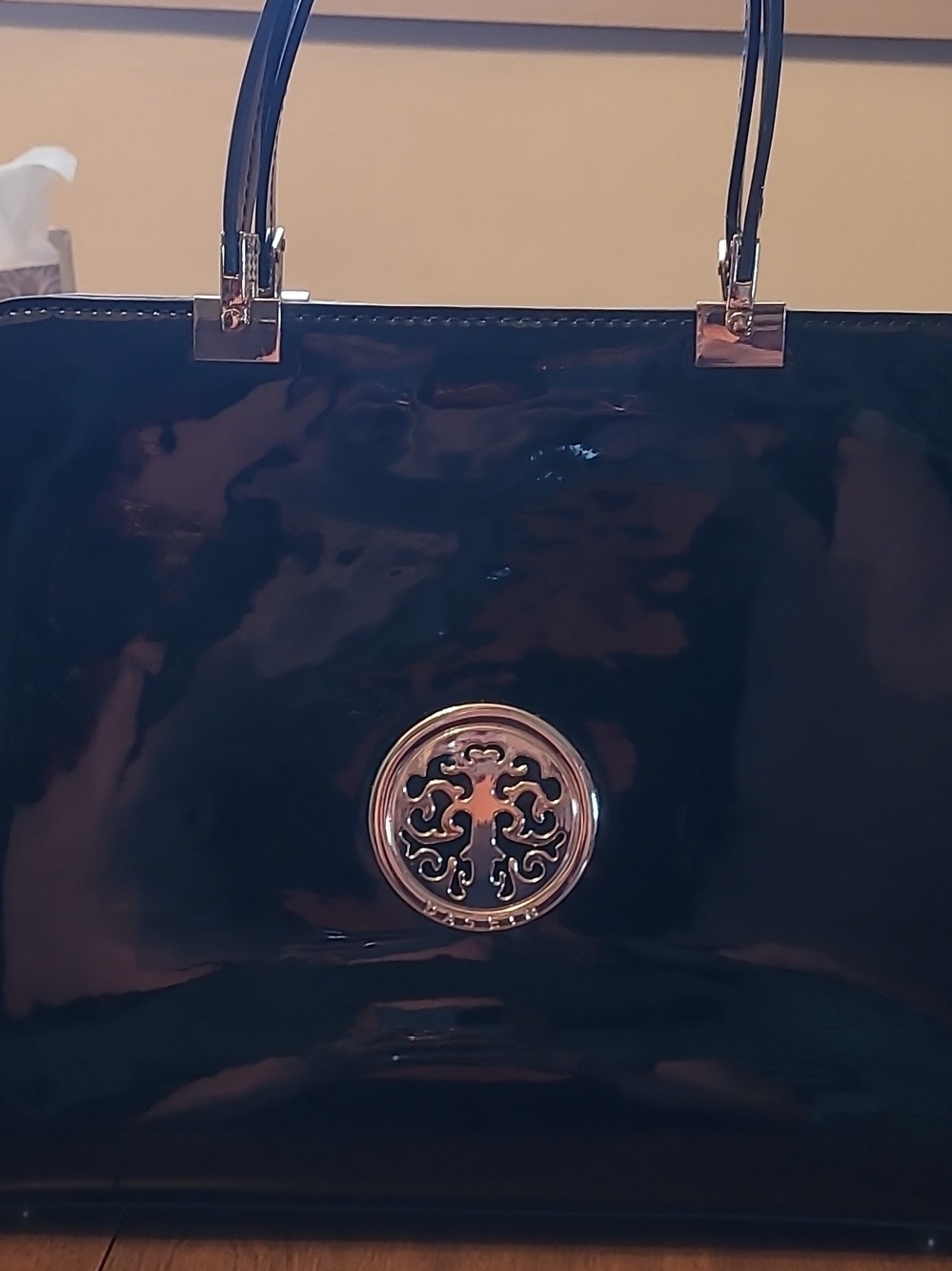 Glossy Black Patent Tote with Decorative Gold Medallion
